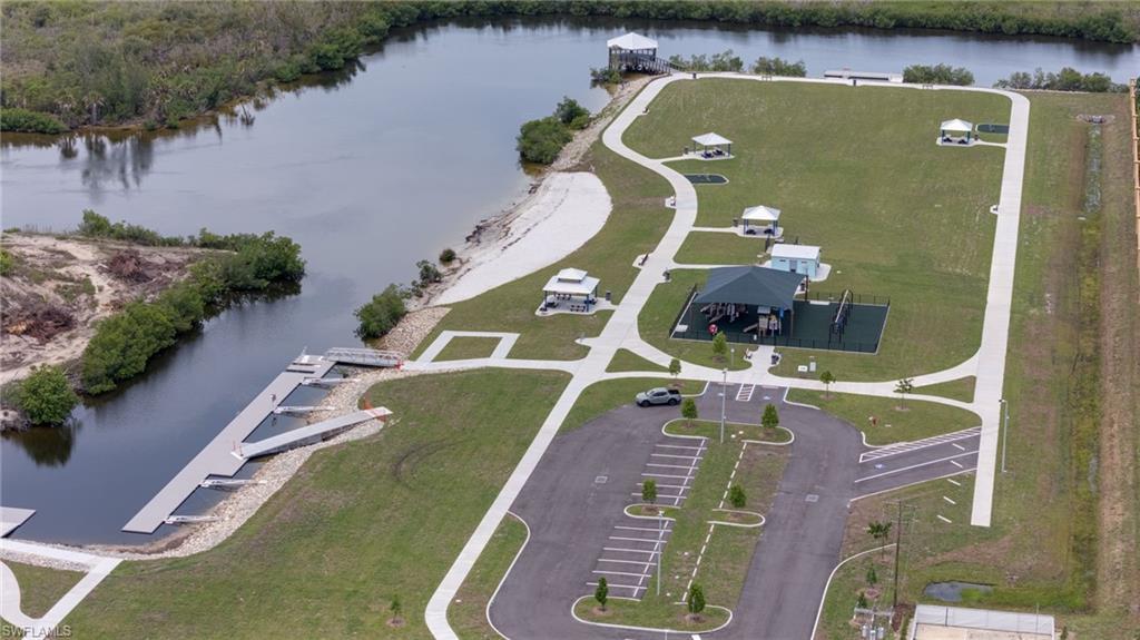 Image 4: Nearby Tropicana park with covered playground area, multiple gazebos, and walking paths.