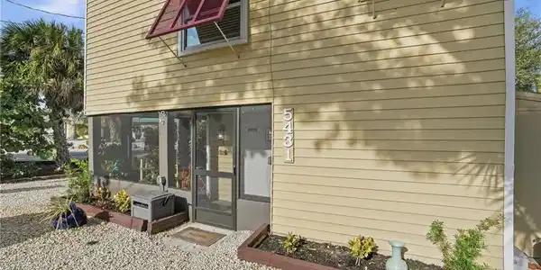Image 3: Doorway to property featuring a sunroom - Virtually Edited Image