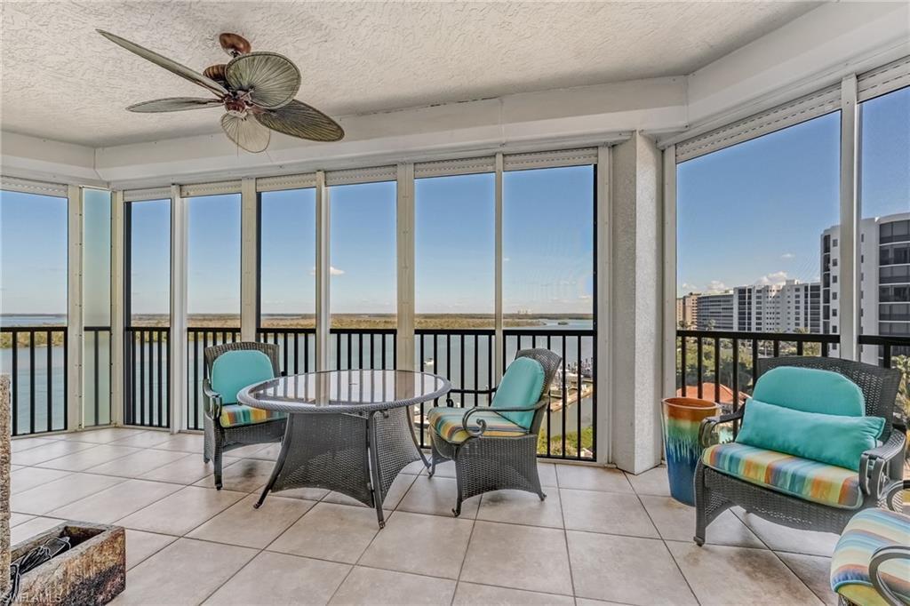 Image 3: Lanai with fabulous bay views, ceiling fan, tile  floors with Electric shutters