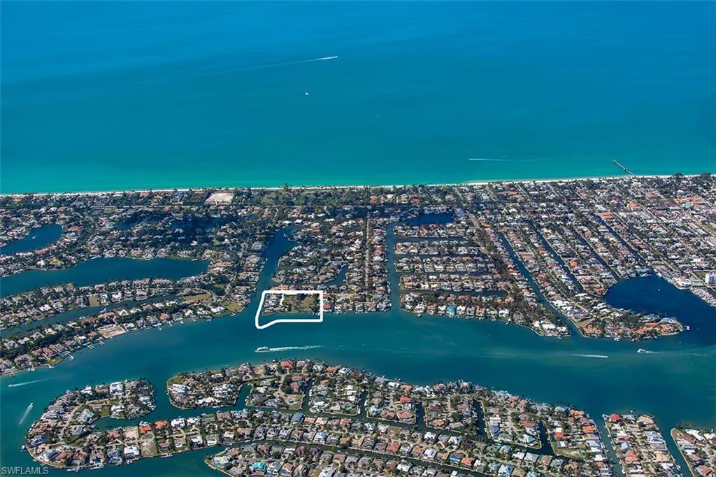 Image 3: Aerial View of Naples Bay and the Gulf.