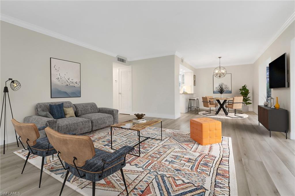 Image 3: Living room featuring luxury vinyl planks