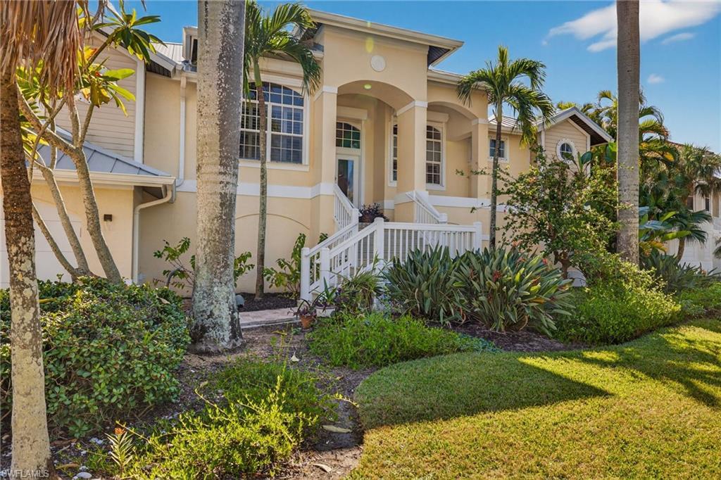 Image 2: Mediterranean / spanish house featuring stucco siding, a front lawn, and covered porch