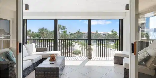 Image 2: Sunroom featuring a textured ceiling and tile patterned floors