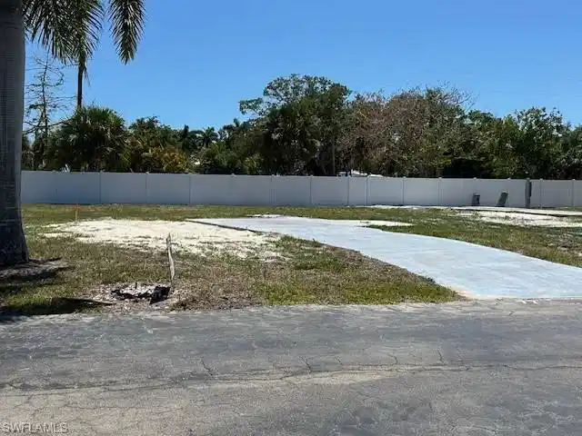 Image 1: New fence added to the back of the lot