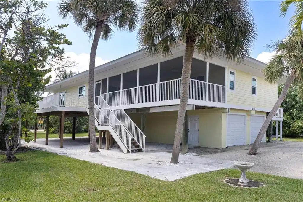 Image 1: Front Elevation - Beautiful Near Beach  Property with HUGE Screened Lanai