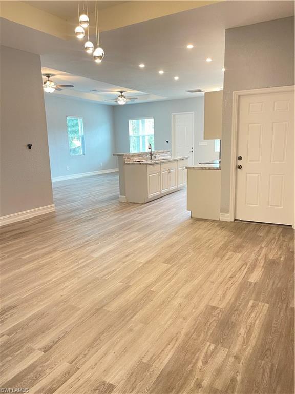 Image 2: Unfurnished room with light wood-style floors and recessed lighting