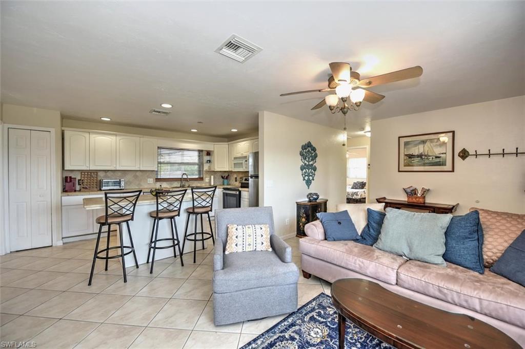 Image 3: Living room featuring recessed lighting, ceiling fan, visible vents, and light tile patterned floors