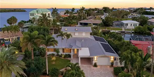 Image 4: Aerial view at dusk of a water view