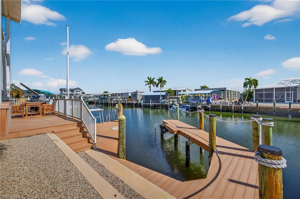 Image 4: Dock area featuring a water view