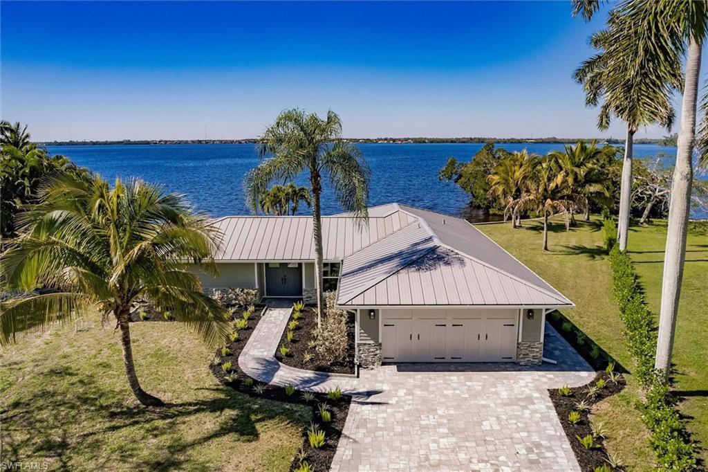Image 1: Drone / aerial view featuring a water view