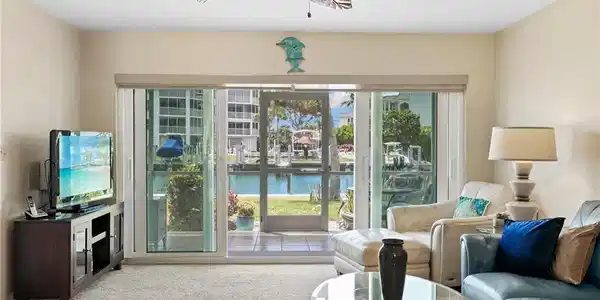 Image 4: Impact-resistant sliders lead out to a waterfront view