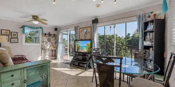 Image 4: Open concept living space featuring tile flooring throughout