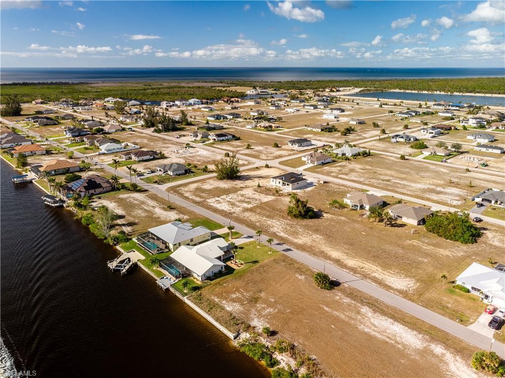 Image 4: Aerial view of the property and surrounding area