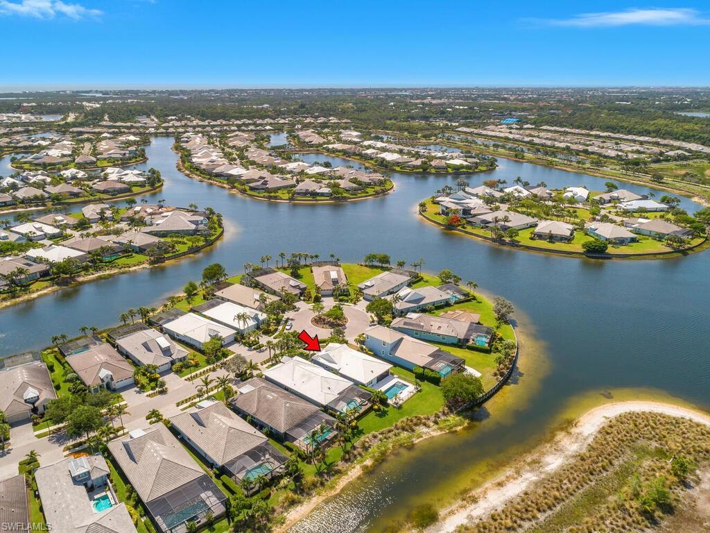 Image 4: Aerial view of property's location featuring nearby suburban area and a nearby body of water