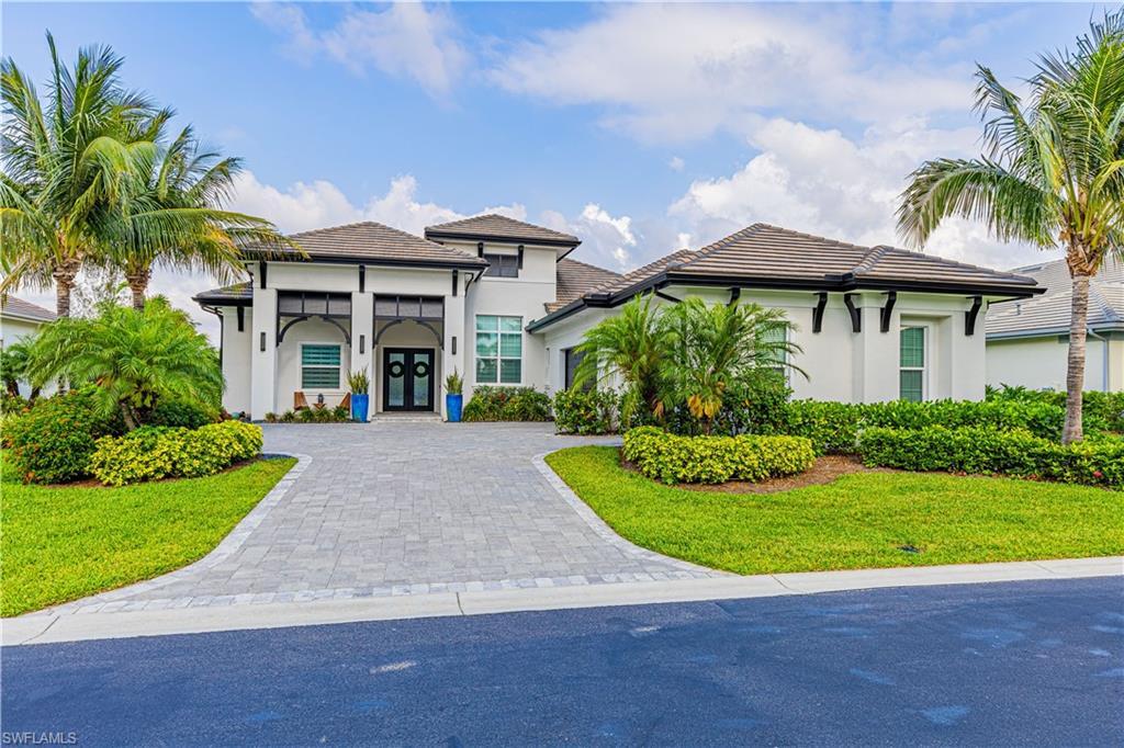Image 2: Extra wide yard and large paved driveway