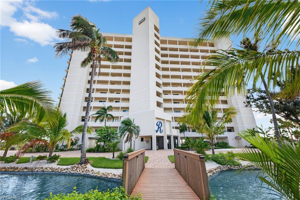 Image 1: View of apartment building / complex with a water view