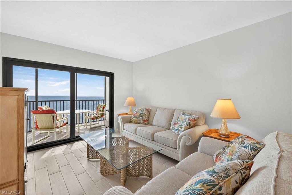 Image 4: Living area featuring a water view and light wood finished floors