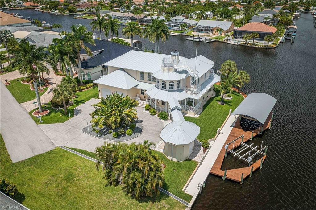Image 1: Bird's eye view featuring a residential view and a water view