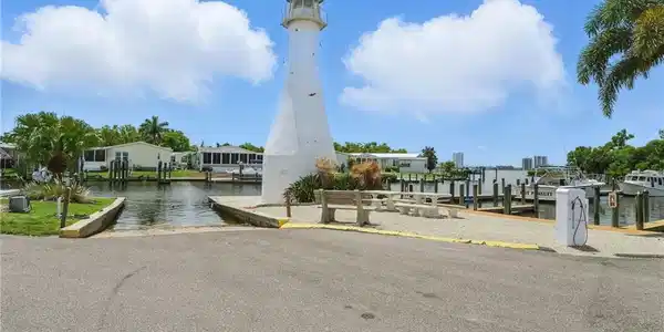 Image 4: View of community featuring a boat ramp, a boat dock, and a water view