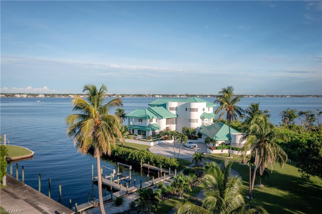 Image 2: Water view featuring a boat dock and boat lift