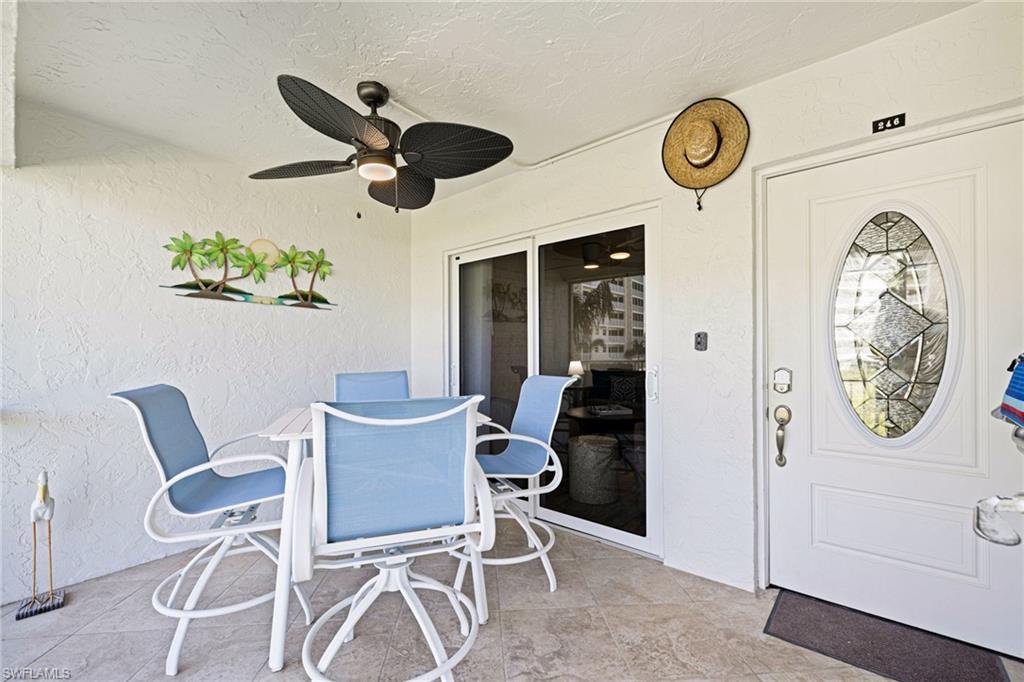 Image 2: View of patio / terrace featuring outdoor dining area and a ceiling fan