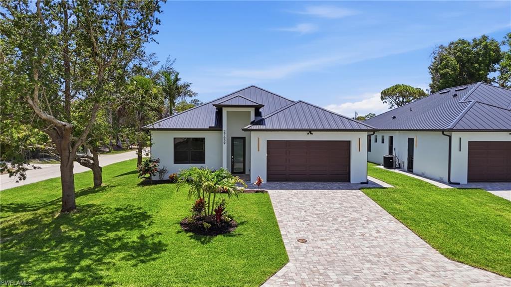 Image 1: Front of home, Corner lot with Mango Tree