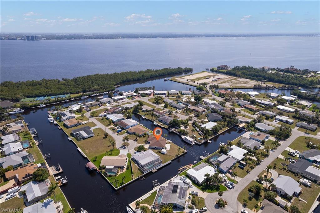 Image 3: Birds eye view of property with a water view and a residential view