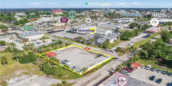 Image 4: Aerial view of property and surrounding area with property parcel outlined