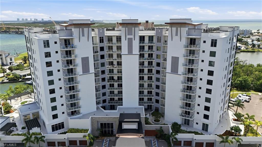 Image 3: View of apartment building / complex featuring a water view - Virtually Edited Image