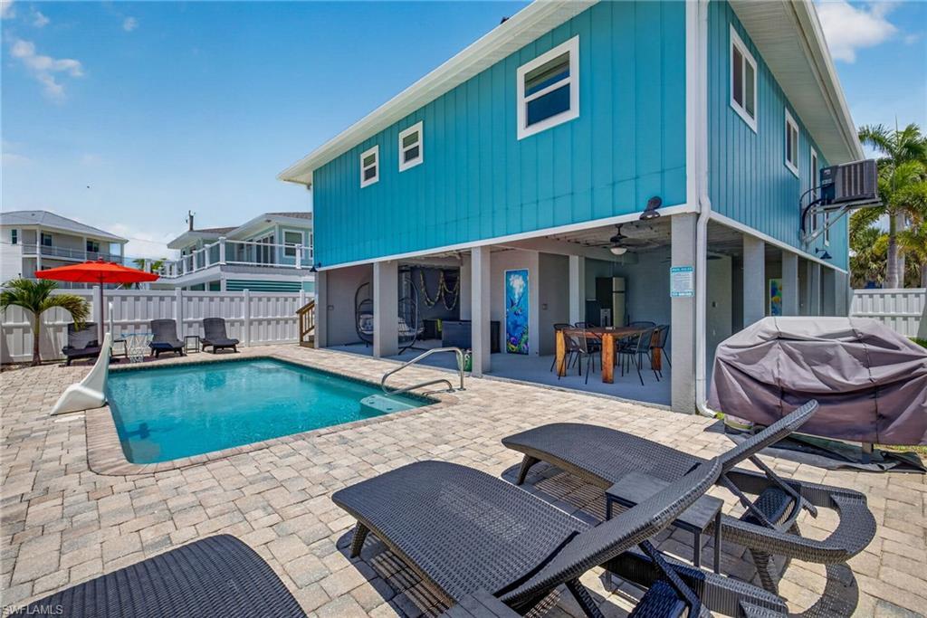 Image 3: Large pool deck with massive covered space!