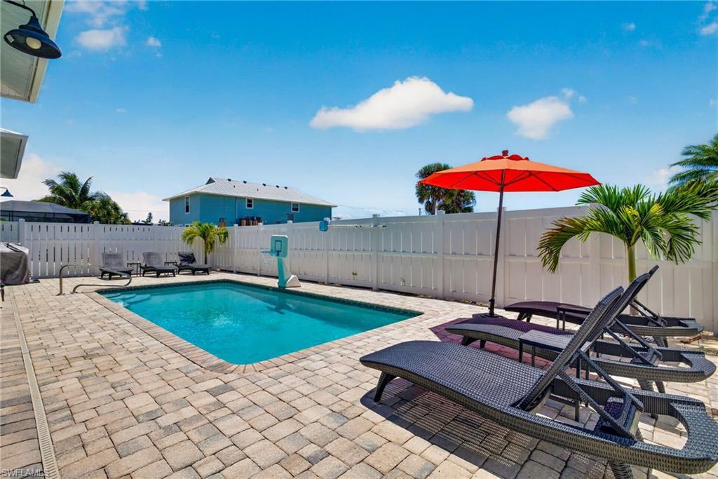 Image 4: Large deck and privacy fence throughout the rear lounging area!