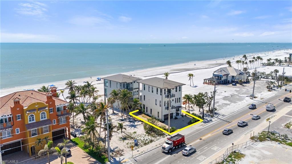 Image 1: Birds eye view of property with a water view and a beach view - VIRTUALLY EDITED