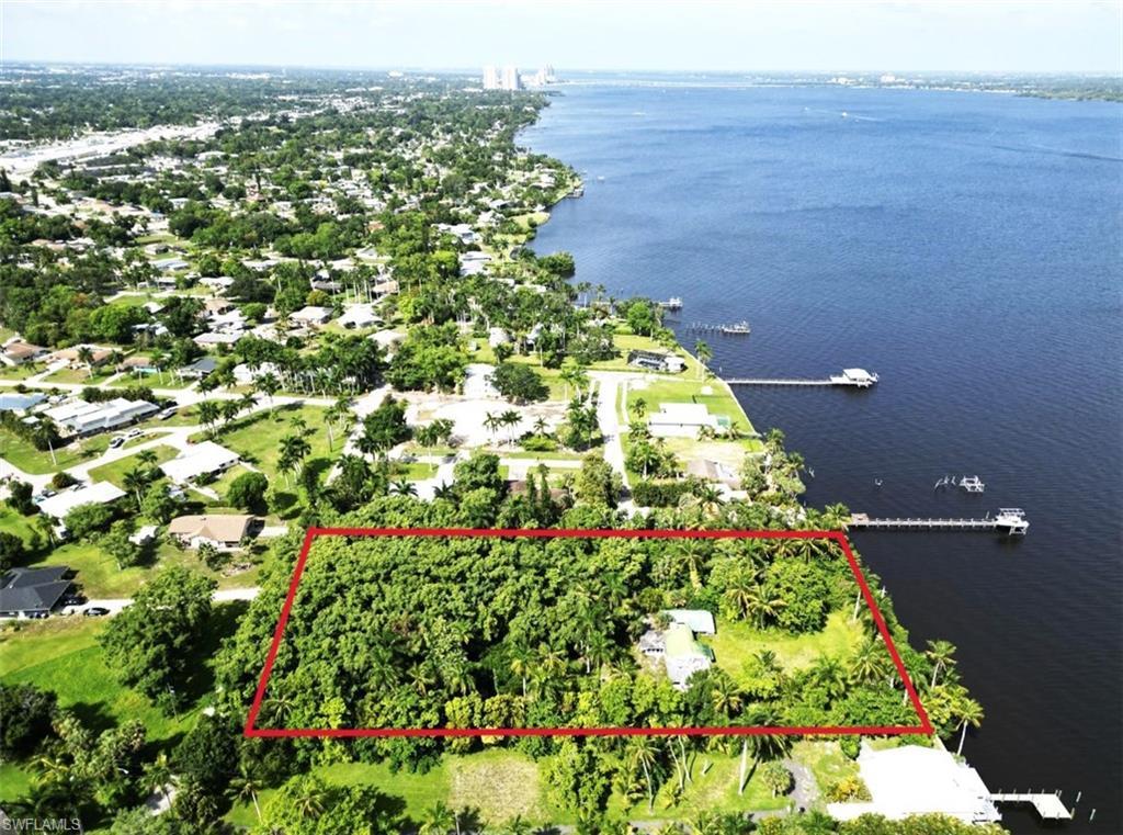 Image 3: Birds eye view of property with a water view