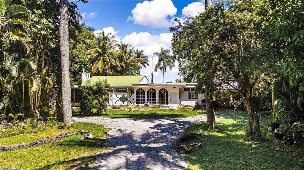 Image 4: Ranch-style house with a front yard