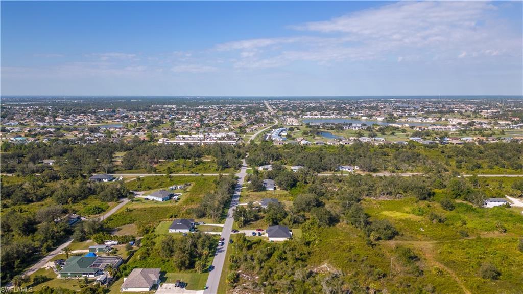 Image 2: View of property location with nearby suburban area