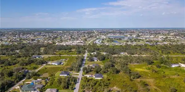 Image 2: View of property location with nearby suburban area