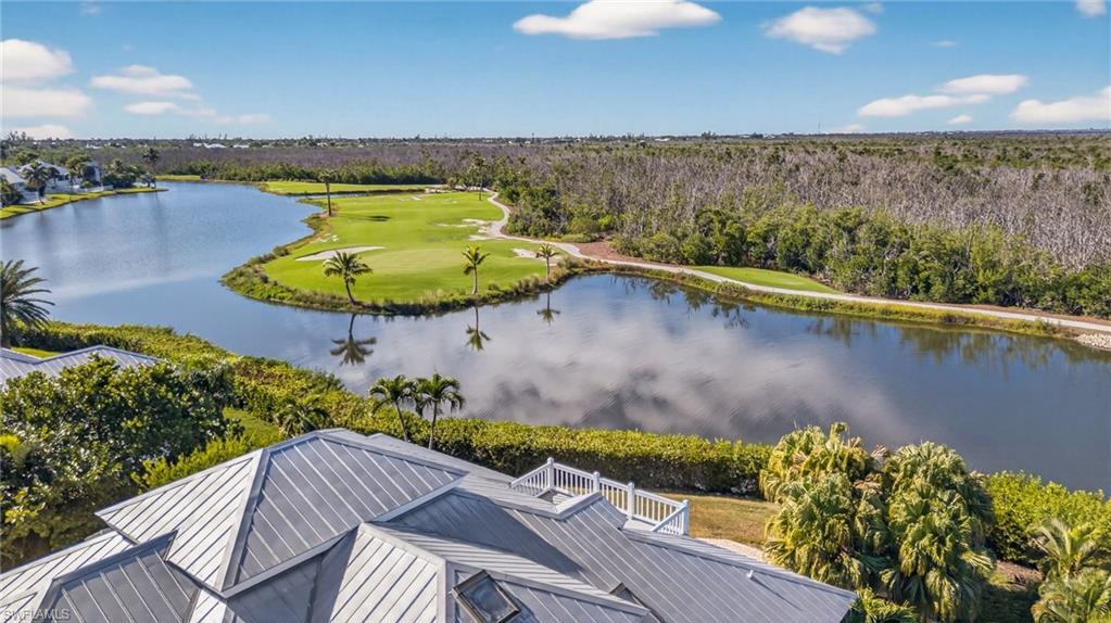 Image 3: Drone / aerial view of a nearby body of water and a golf club