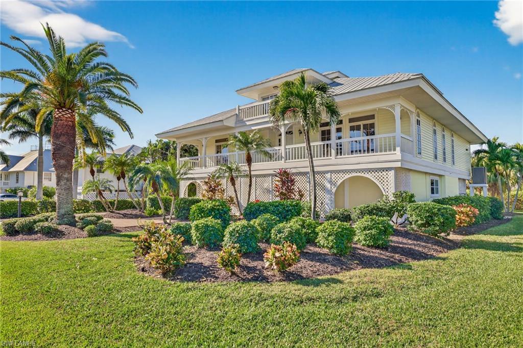 Image 4: View of front facade featuring a front yard