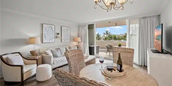 Image 3: Enjoy a glass of wine while taking in the gulf and palm tree views.
