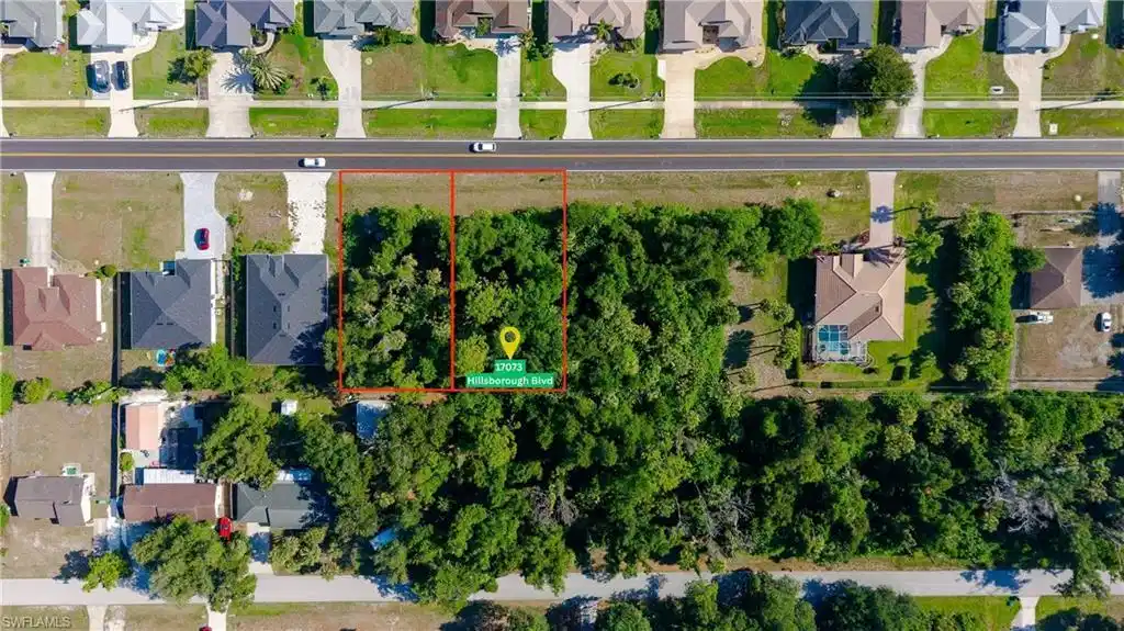 Image 1: Vacant land parcels featuring mature trees and street frontage