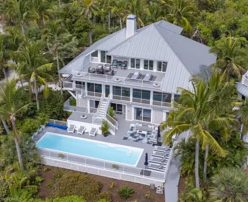 Image 1: Back of property with an outdoor pool