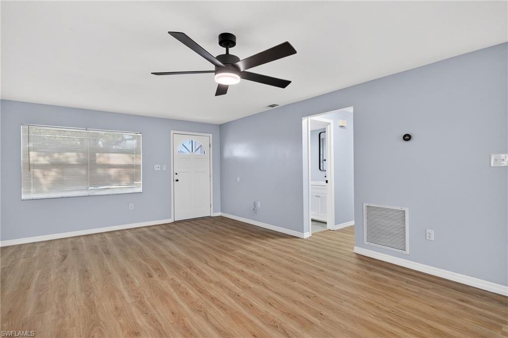 Image 3: Entrance foyer with light wood-style flooring and ceiling fan