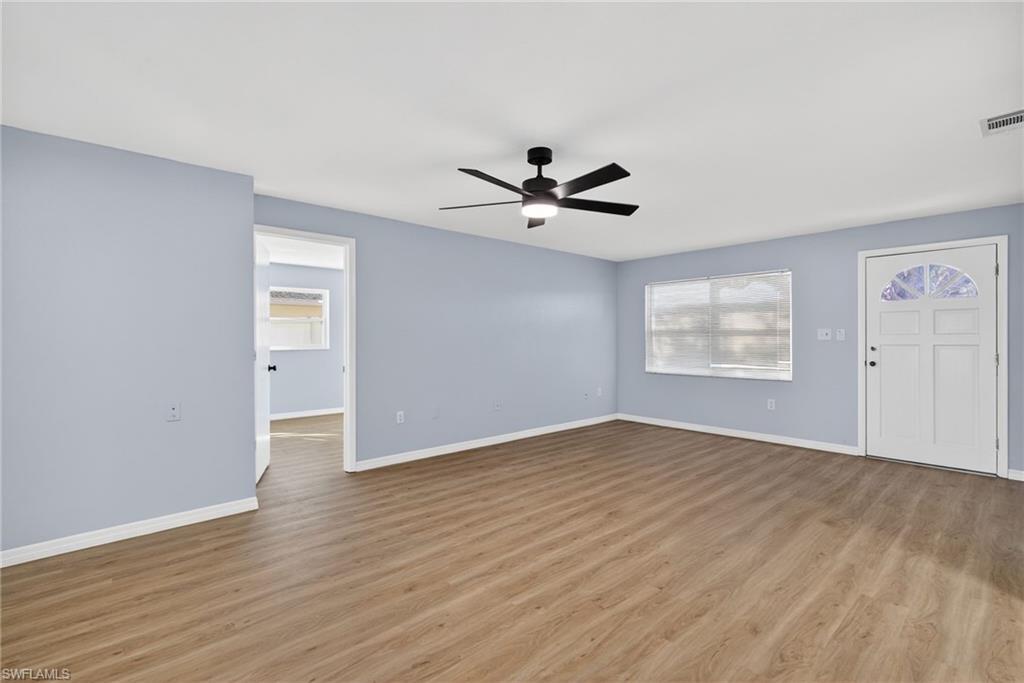Image 4: Unfurnished living room with a ceiling fan and wood finished floors