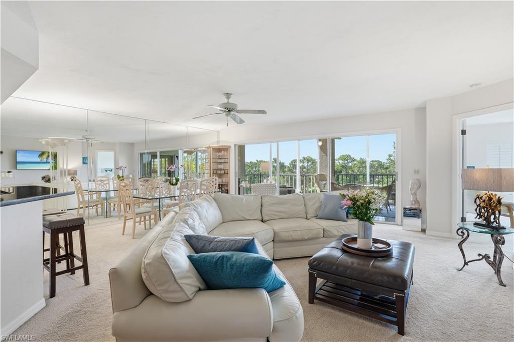Image 2: A wide open great room filled with abundant natural light.