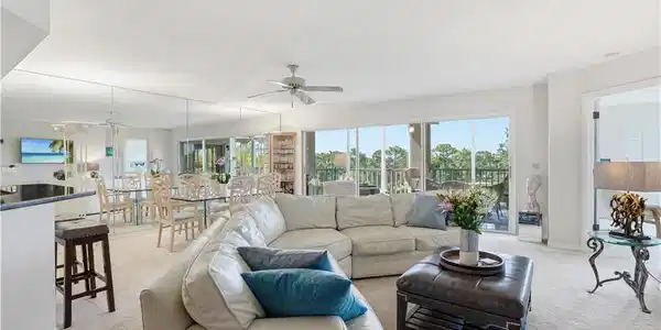 Image 2: A wide open great room filled with abundant natural light.