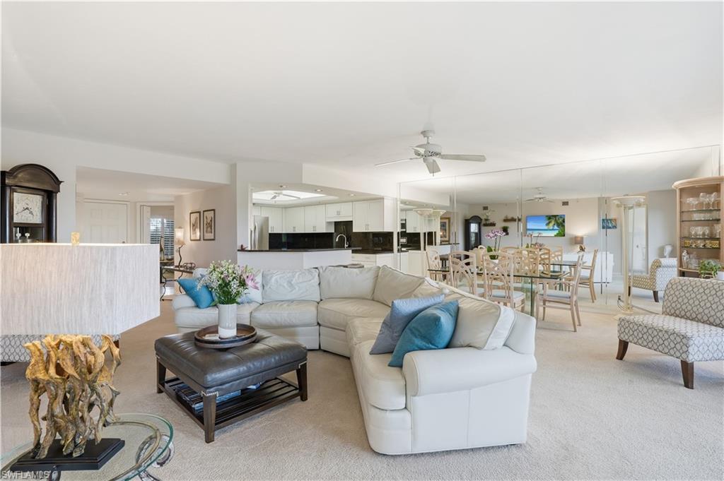 Image 4: The living, dining, and kitchen areas flow together seamlessly.