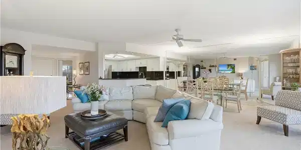 Image 4: The living, dining, and kitchen areas flow together seamlessly.