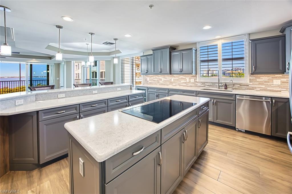 Image 3: Gorgeous remodeled kitchen with island, cooktop and great view