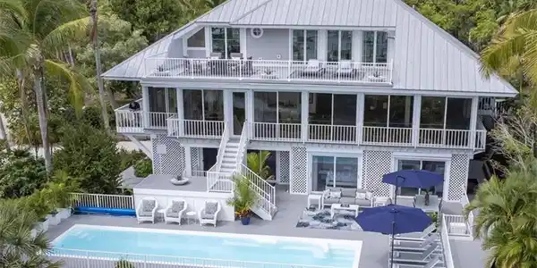Image 3: Back of house featuring a patio area, an outdoor pool