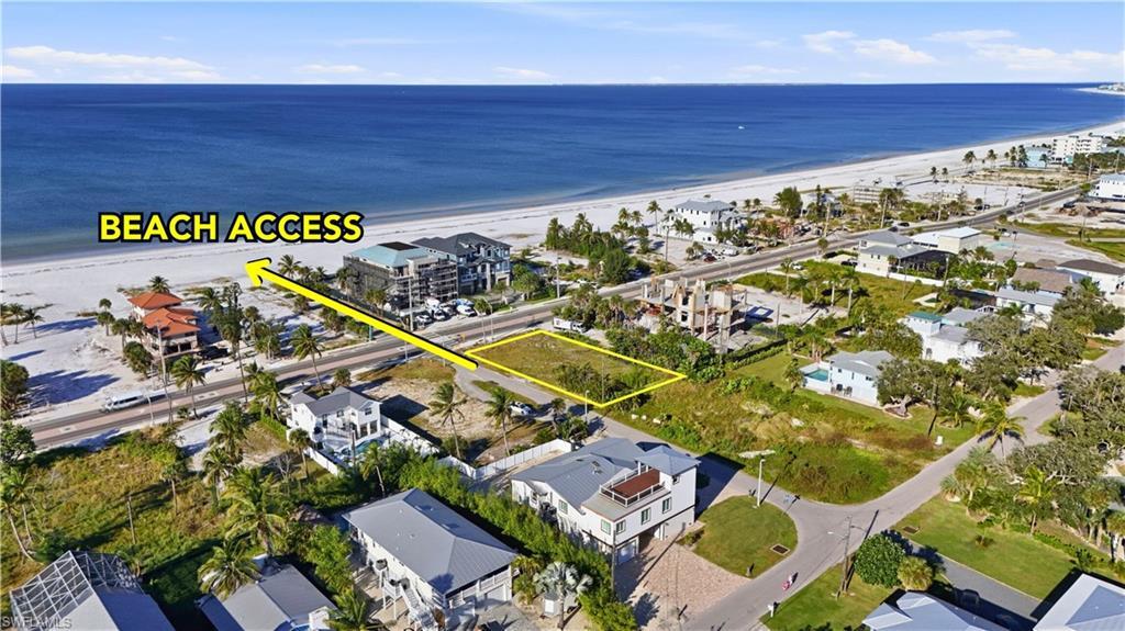 Image 1: Aerial view of property's location featuring expansive coastline and property boundaries highlighted - Virtually Edited Image